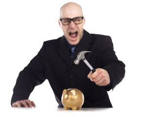 businessman breaking piggy bank © Dan Kosmayer