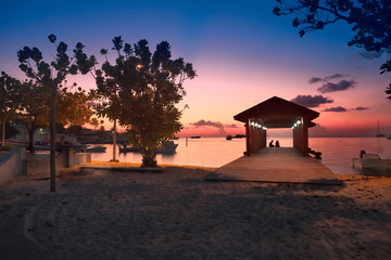 Paradise Maldives beach at pink sunset