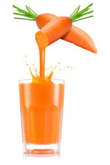 Pure carrot juice pouring out from fruit in glass - obrazy, fototapety, plakaty