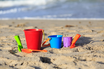 kids toys on tropical sand beach