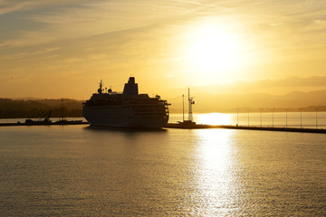 Obraz premium The cruise ship during sunset in Kerkyra port, Corfu island, Gre