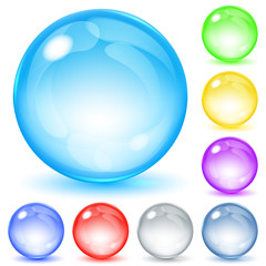 Set of transparent glass spheres of various colors with glares and shadows. Transparency only in vector file