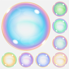 Set of multicolored transparent soap bubbles with glares. Transparency only in vector format. Can be used with any background