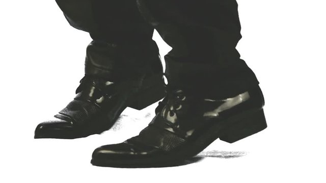 closeup of the walking legs in black shoes, experiencing people.

The white background to evaluate the picture, green for ease of separation of the object from the background.
