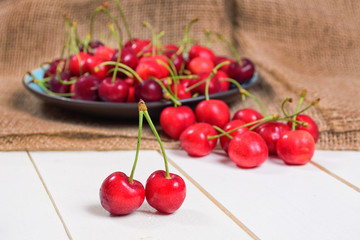 Fresh cherries on wooden table