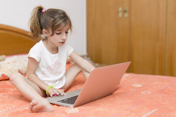 Girl sitting with a laptop