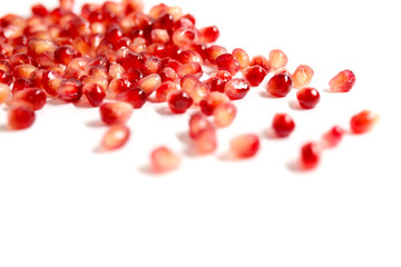 Seeds of pomegranate on a white background