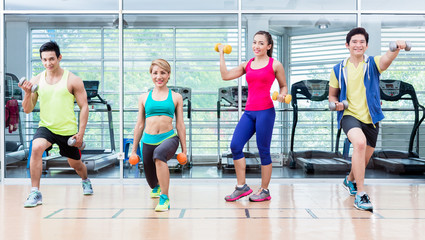 Sportsmen and sportswomen executing functional training