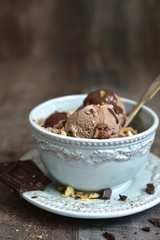 Chocolate ice cream  with walnut in a vintage bowl.