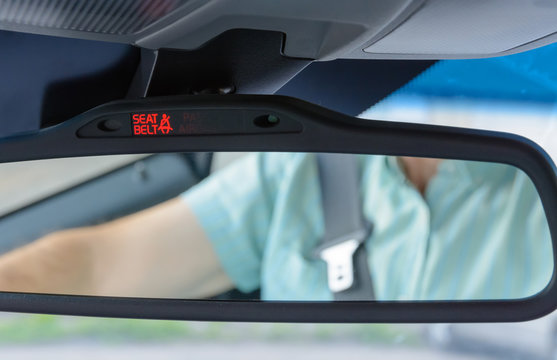 Seatbelt sign showing on the Car Rearview Mirror