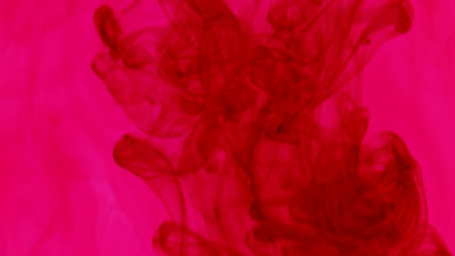 Red ink in pink water