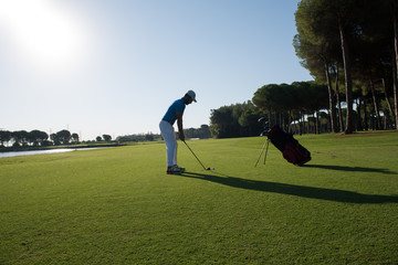 golf player hitting shot