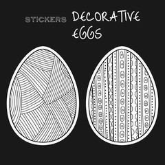 Black, white decorative eggs. Set of stickers on black background.