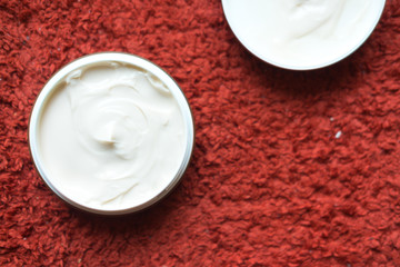 Hair wax and clay in tubs