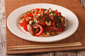 Thai Food: Fried chicken with vegetables and cashew nuts closeup. horizontal
