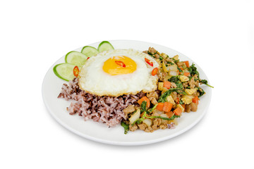 Fried egg with stir-fried minced pork and basil  isolated on whi