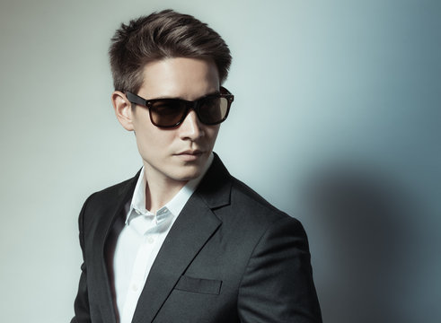 handsome male wearing suit and sunglasses. 