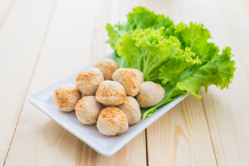 Grill pork balls on wooden table
