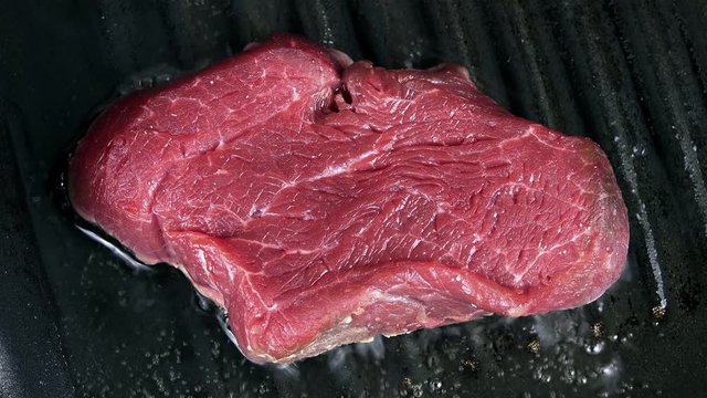 Beef fillet in a pan (selective focus) as high detailed 4K UHD footge