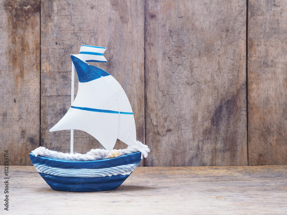 Wall mural white and blue sailboat toy