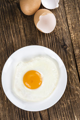 Fried Eggs on wooden background
