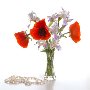 Bouquet of red poppies and irises.