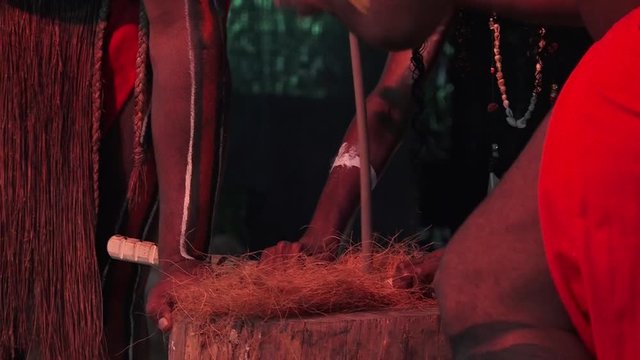 Yugambeh Aboriginal peopel demonstrate fire making craft during Aboriginal culture show in Queensland, Australia.