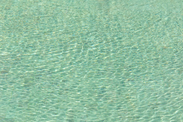 Green swimming pool rippled water detail