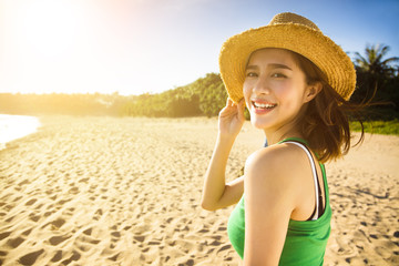 happy young woman enjoy summer vacation on the beach