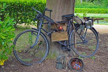 Fototapeta na wymiar Vintage bicycle with World War 2 German Equipment Including Machine gun and Helmet.