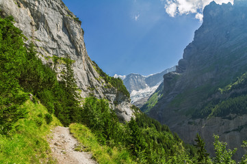 Fototapeta na wymiar Beautiful idyllic Alps landscape and trail, mountains in summer, Switzerland 
