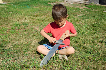 Boy machete edge sharpening © aynur_sh