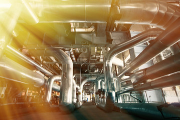 Equipment, cables and piping as found inside of a modern industr