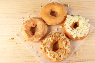 Donuts on wooden background