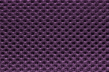 Purple and violet fishnet cloth material texture background. Nylon texture. Nylon fabric. Nylon bag for background with copy space for text or image.