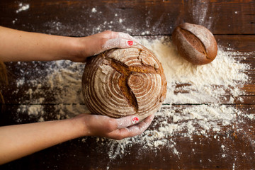 Brown bread in hands