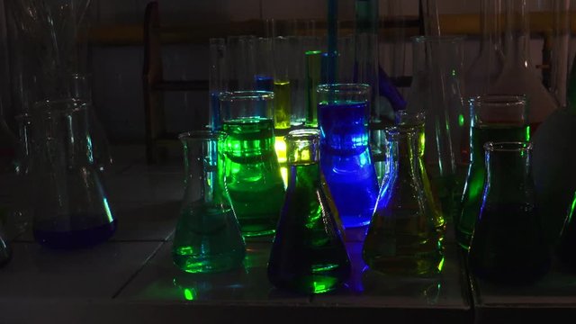 Scientific measurements with multicolored liquids and substances in chemistry lab, ULTRA HD 4K, real time