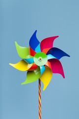 Colorful pinwheel isolated on blue background