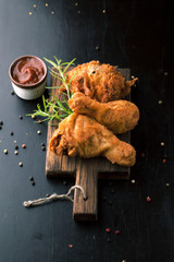 Fried chicken legs with fried potatoes - 112367315
