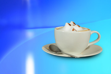 Hot cappuccino coffee cup on desk with modern background