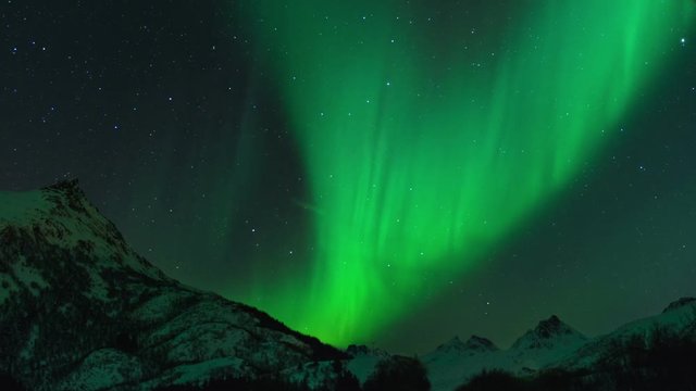 Time lapse clip of Polar Light or Northern Light (Aurora Borealis) in the night sky over the Lofoten islands in Norway in winter. Cinemagraph clip.