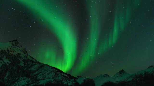 Time lapse clip of Polar Light or Northern Light (Aurora Borealis) in the night sky over the Lofoten islands in Norway in winter. Cinemagraph clip.