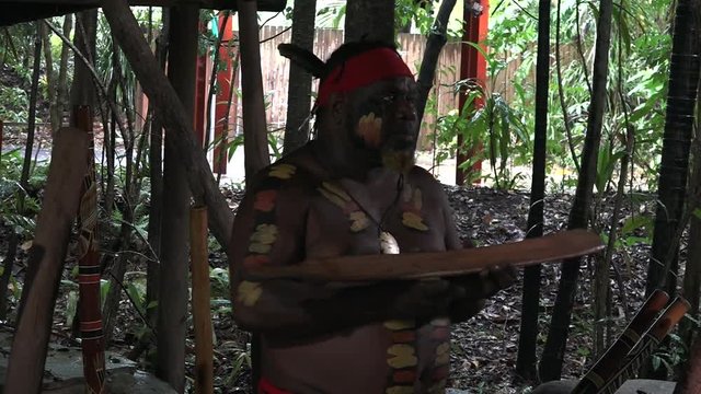 Yirrganydji Aboriginal man explains about the didgeridoo during cultural show in Queensland, Australia