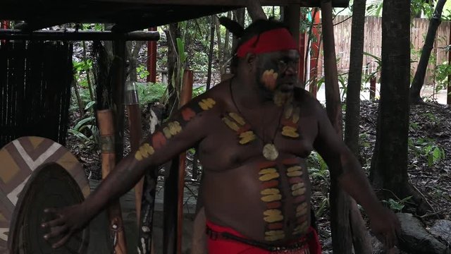 Yirrganydji Aboriginal man explains about the didgeridoo during cultural show in Queensland, Australia