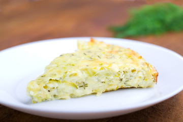 piece casserole with vegetables on a plate,selective focus