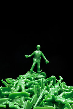 green toy soldiers on dark