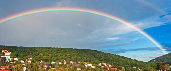 Rainbow landscape blue sky