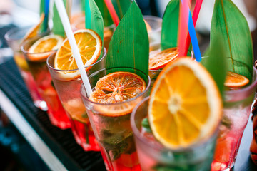 Colorful cocktails close up. an open-air party. after the rain
