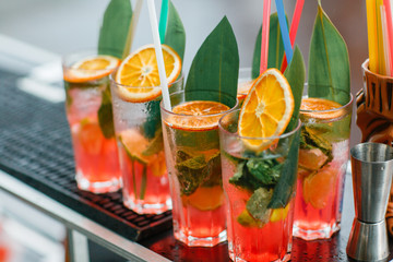 Colorful cocktails close up. an open-air party. after the rain