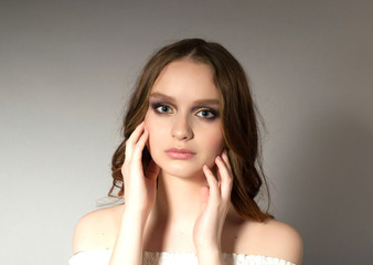 Naklejka premium The girl with naked shoulders and beautiful, long hair
